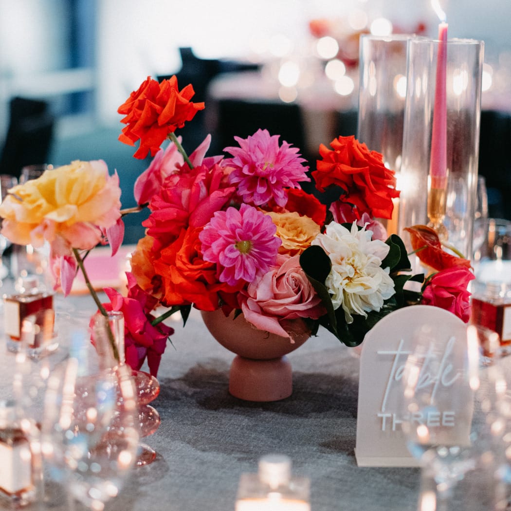 Floral decorations for a beautiful wedding with red and lilac flowers